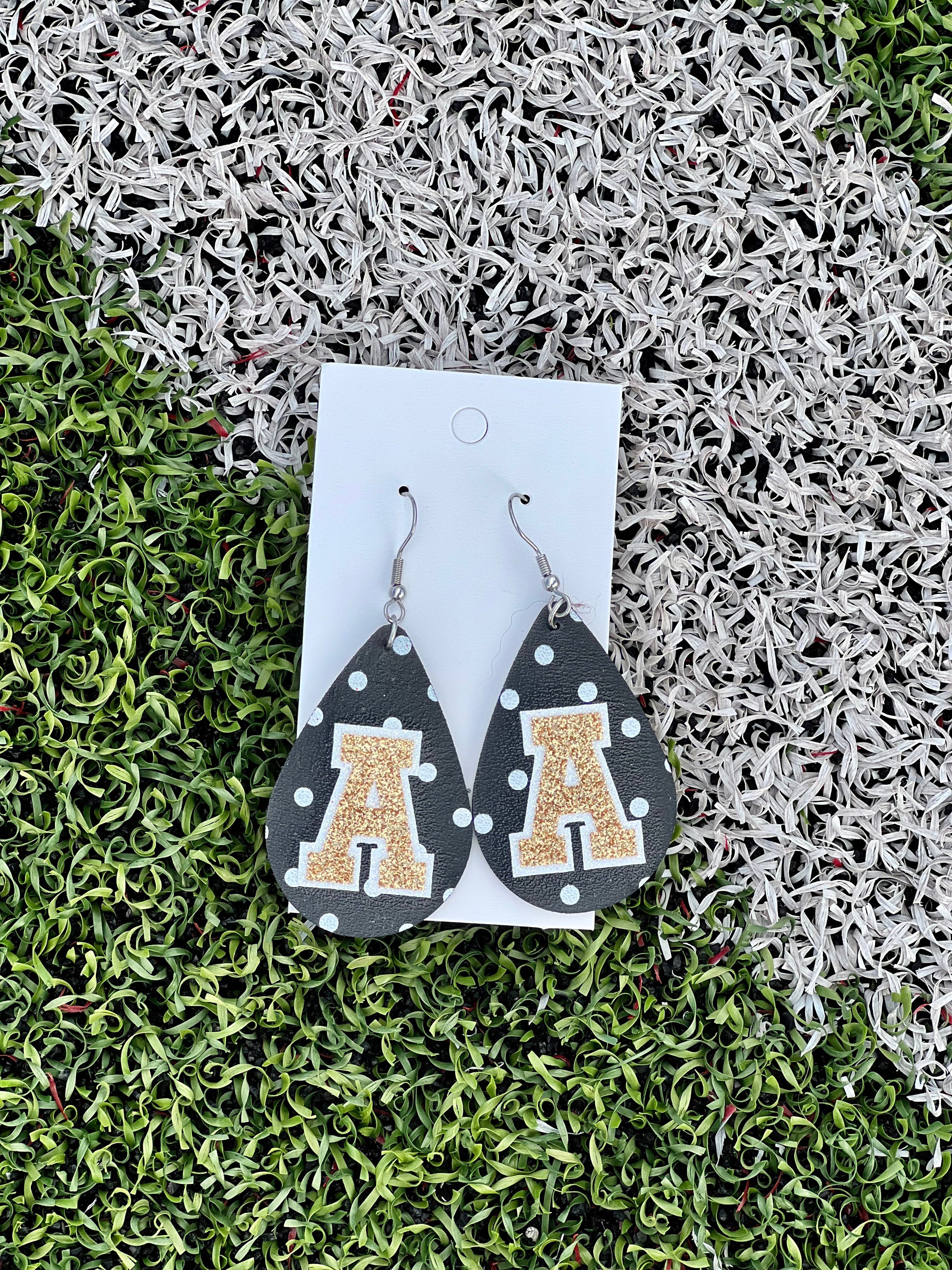 A (gold/black) Varsity Dot Teardrops